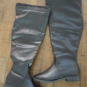 Black knee high boots.